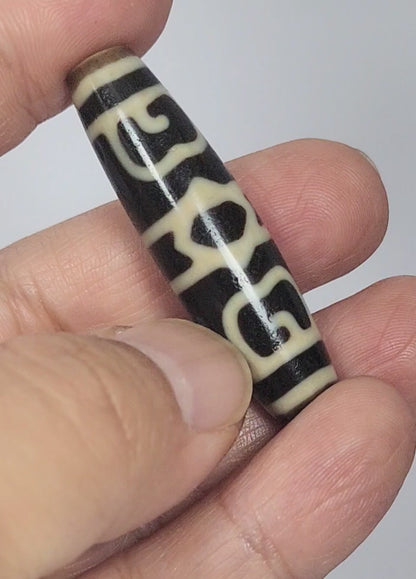 At-090626-GRDC2 antique Guru Rinpoche Dharma Cap dzi bead 49.8x13.2mm rotating 360 view pitch-black agate all faces unretouched