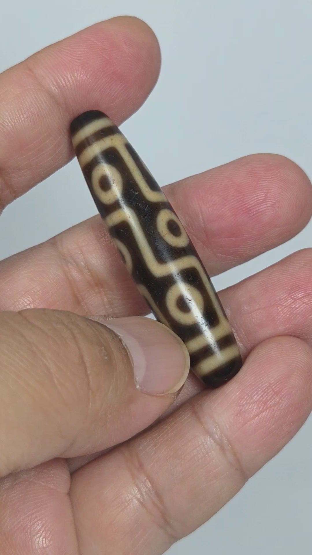 At-091626-9E antique Tibetan nine eye dzi bead 54.6x12.5mm dark brown agate rotating view all faces unretouched