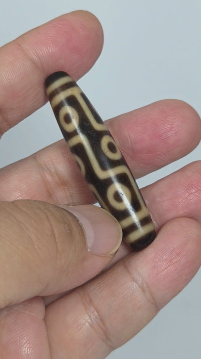 At-091626-9E antique Tibetan nine eye dzi bead 54.6x12.5mm dark brown agate rotating view all faces unretouched