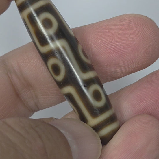 video of Antique Nine Eye dzi bead showing all angles of connected eye network with warm tonal brown agate ground, At-083025-9E3