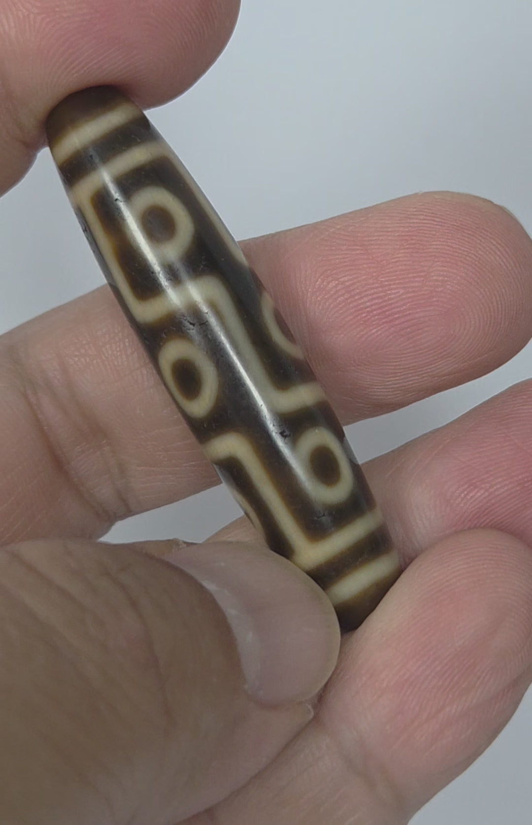 video of Antique Nine Eye dzi bead showing all angles of connected eye network with warm tonal brown agate ground, At-083025-9E3