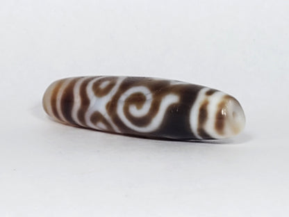 At-061926-PDEBS angled tip B, honey-tan cap, small drill hole, scroll detail visible, unretouched