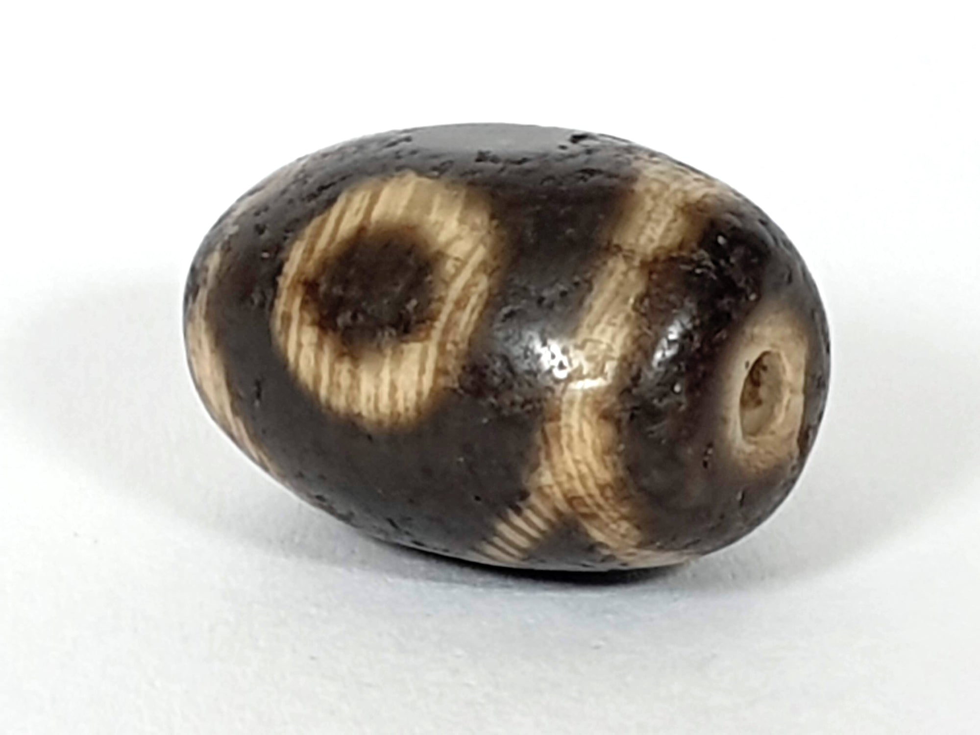 Ancient Two Eye & Tiger Tooth Motif Pumtek Bead