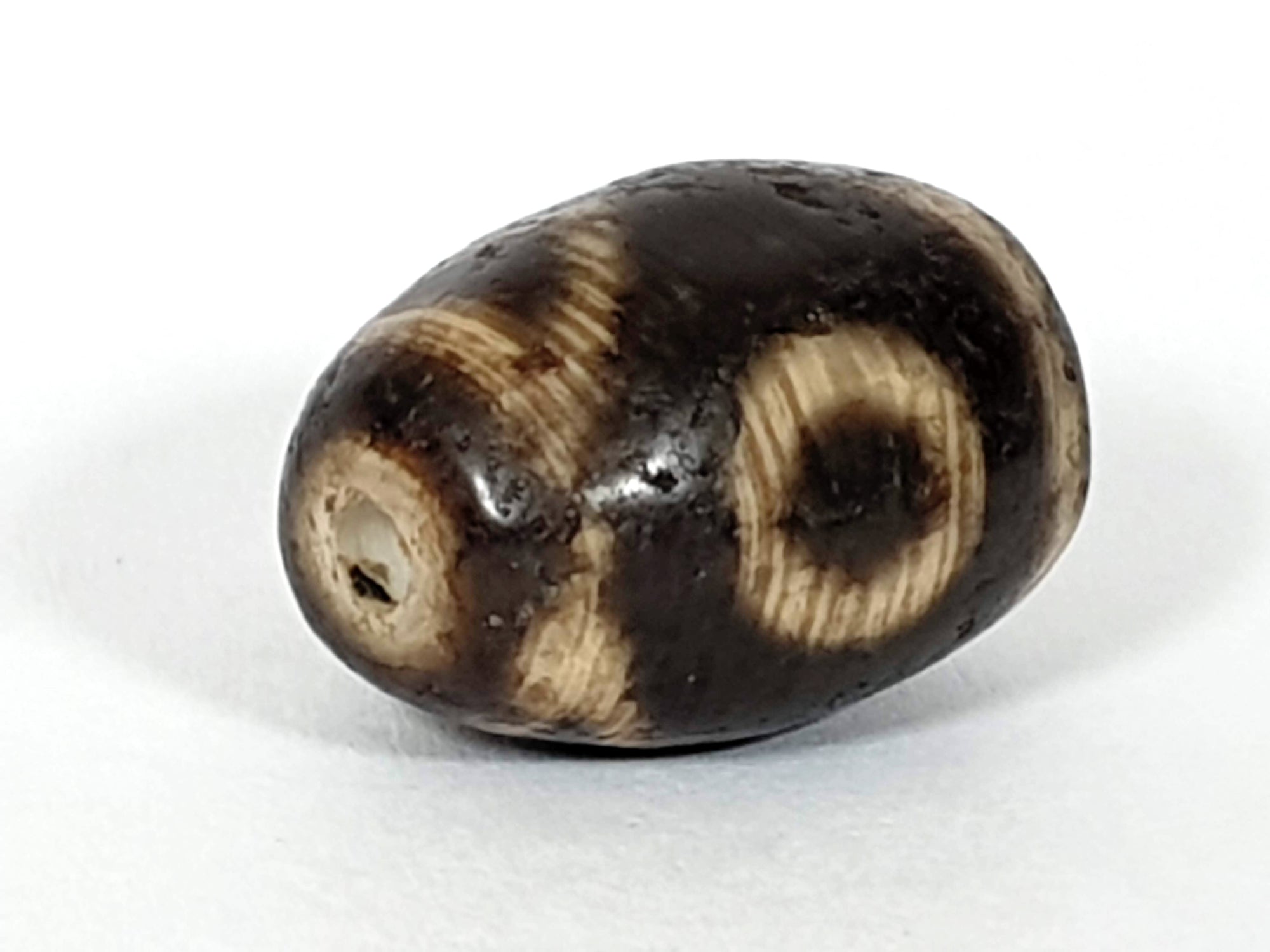 Ancient Two Eye & Tiger Tooth Motif Pumtek Bead